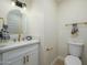 Modern powder room with white vanity and gold fixtures at 2003 E Magdalena Dr, Tempe, AZ 85283