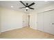 Bedroom with ceiling fan and double door closet at 2003 E Magdalena Dr, Tempe, AZ 85283