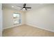 Well lit bedroom with large window and ceiling fan at 2003 E Magdalena Dr, Tempe, AZ 85283