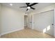 Bedroom with double doors and ceiling fan at 2003 E Magdalena Dr, Tempe, AZ 85283