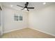 Bright bedroom with ceiling fan and laminate wood floor at 2003 E Magdalena Dr, Tempe, AZ 85283