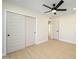 Bright bedroom with double door closet and ceiling fan at 2003 E Magdalena Dr, Tempe, AZ 85283