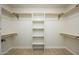 Large walk-in closet with shelves and hanging rods at 2003 E Magdalena Dr, Tempe, AZ 85283