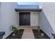 Inviting front entrance with dark double doors and landscaping at 2003 E Magdalena Dr, Tempe, AZ 85283