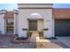 Front entry with arched walkway and dark double doors at 2003 E Magdalena Dr, Tempe, AZ 85283