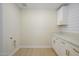 Clean laundry room with white cabinets and countertop at 2003 E Magdalena Dr, Tempe, AZ 85283