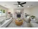 Bright living room featuring a whitewashed brick fireplace and comfortable seating at 2003 E Magdalena Dr, Tempe, AZ 85283