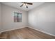 Bright bedroom with laminate flooring and ceiling fan at 205 N 74Th St # 122, Mesa, AZ 85207