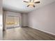 Spacious bedroom with wood-look flooring and access to a patio at 205 N 74Th St # 122, Mesa, AZ 85207