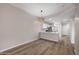 Light and airy dining area with wood-look floors and kitchen access at 205 N 74Th St # 122, Mesa, AZ 85207