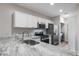 Modern kitchen with granite countertops and stainless steel appliances at 205 N 74Th St # 122, Mesa, AZ 85207