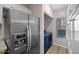 Kitchen with stainless steel refrigerator and laundry area at 205 N 74Th St # 122, Mesa, AZ 85207