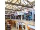 Indoor view of a shopping mall with various stores and a high ceiling at 205 N 74Th St # 122, Mesa, AZ 85207