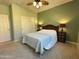 Bedroom featuring carpet, ceiling fan, a comfortable bed, and closet at 21280 N 262Nd Dr, Buckeye, AZ 85396