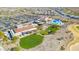 Community clubhouse with pool, green spaces and parking at 21280 N 262Nd Dr, Buckeye, AZ 85396