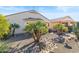 Landscaped backyard with rock pathway and desert plants at 21280 N 262Nd Dr, Buckeye, AZ 85396