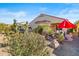 Landscaped backyard with desert plants and gravel at 21280 N 262Nd Dr, Buckeye, AZ 85396