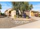 Single-story home with desert landscaping and two-car garage at 21280 N 262Nd Dr, Buckeye, AZ 85396