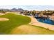 Golf course with water features and scenic mountain views at 21280 N 262Nd Dr, Buckeye, AZ 85396