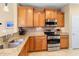 Modern kitchen with stainless steel appliances and granite counters at 21280 N 262Nd Dr, Buckeye, AZ 85396