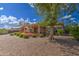 Backyard patio area with solar panels and lush landscaping at 21413 N 159Th Dr, Sun City West, AZ 85375