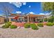 Large backyard with a covered patio and solar panels at 21413 N 159Th Dr, Sun City West, AZ 85375