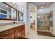 Bathroom features a large vanity and walk-in shower at 21413 N 159Th Dr, Sun City West, AZ 85375