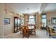 Formal dining room with wood table and chairs, and built-in hutch at 21413 N 159Th Dr, Sun City West, AZ 85375