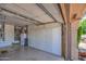 Garage with built-in storage cabinets and extra space at 21413 N 159Th Dr, Sun City West, AZ 85375