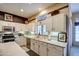 White kitchen with stainless steel appliances at 21413 N 159Th Dr, Sun City West, AZ 85375