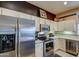 Stainless steel appliances and white cabinets at 21413 N 159Th Dr, Sun City West, AZ 85375