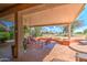 Relaxing covered patio with seating area and golf course view at 21413 N 159Th Dr, Sun City West, AZ 85375