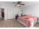 Bedroom with double bed, tile floors and ceiling fan at 21543 W Church Ave, Wittmann, AZ 85361