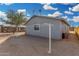 Home exterior showcasing side yard and clothesline at 21543 W Church Ave, Wittmann, AZ 85361