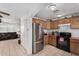 Kitchen with stainless steel appliances and wood cabinets at 21543 W Church Ave, Wittmann, AZ 85361