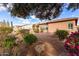 Landscaped backyard with desert plants and gravel at 23242 S 202Nd Way, Queen Creek, AZ 85142