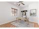 Home office with built-in shelving and wood floors at 23242 S 202Nd Way, Queen Creek, AZ 85142