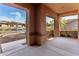 Covered patio with view of the front yard and street at 23242 S 202Nd Way, Queen Creek, AZ 85142