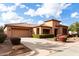 Front view of two-story home with attached garage at 23242 S 202Nd Way, Queen Creek, AZ 85142