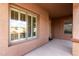 Front porch with window and door, showing a well-maintained exterior at 23242 S 202Nd Way, Queen Creek, AZ 85142