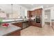 Kitchen with dark wood cabinets and granite countertops at 23242 S 202Nd Way, Queen Creek, AZ 85142