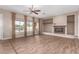 Living room with built-in shelving and fireplace at 23242 S 202Nd Way, Queen Creek, AZ 85142