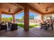 Spacious covered patio with seating area and outdoor dining at 23242 S 202Nd Way, Queen Creek, AZ 85142