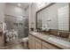 Modern bathroom with double sinks and a hexagonal tiled shower at 2351 E Cherrywood Pl, Chandler, AZ 85249