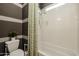 Clean bathroom with shower/tub combo and striped walls at 2351 E Cherrywood Pl, Chandler, AZ 85249