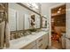 Elegant bathroom with double sinks, and a view into a playroom at 2351 E Cherrywood Pl, Chandler, AZ 85249