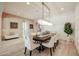 Elegant dining room with a spacious table and statement chandelier at 2351 E Cherrywood Pl, Chandler, AZ 85249