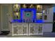 Fully-stocked outdoor bar with blue LED lighting at 2351 E Cherrywood Pl, Chandler, AZ 85249