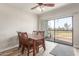 Bright dining area with wood table and chairs, and view to golf course at 2524 S El Paradiso -- # 76, Mesa, AZ 85202