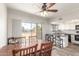 Kitchen dining area with wood table and chairs, and sliding glass doors to patio at 2524 S El Paradiso -- # 76, Mesa, AZ 85202